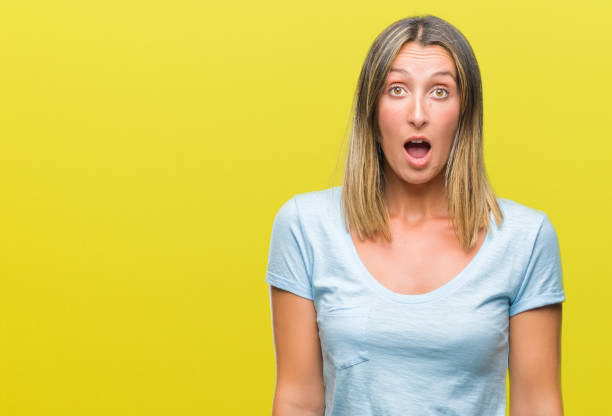 istock Young beautiful woman over isolated background afraid and shocked with surprise expression, fear and excited face. 1081481896