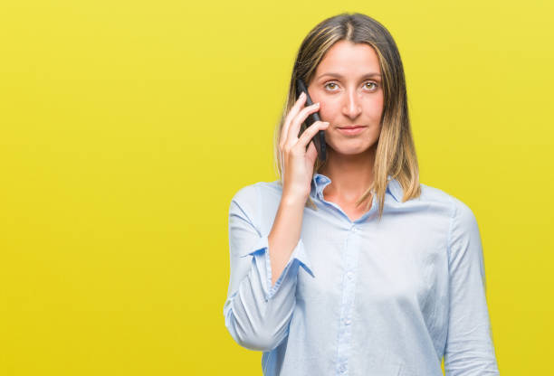 istock Young beautiful woman talking on smartphone over isolated background with a confident expression on smart face thinking serious 1081482044