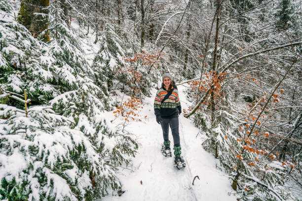 istock Friends hike along snowy foot path 1081488754