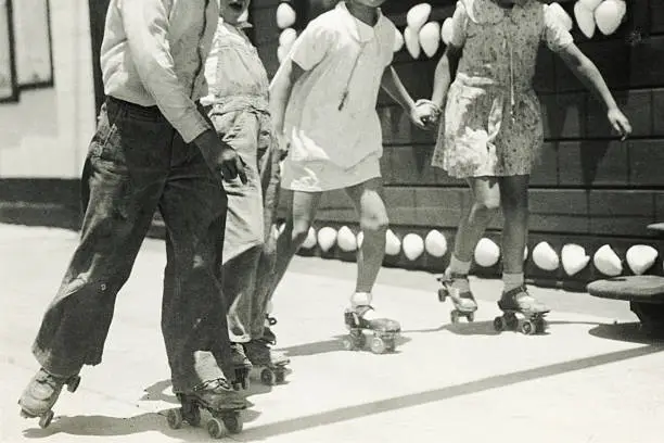 Photo of Black and White Roller Skaters.