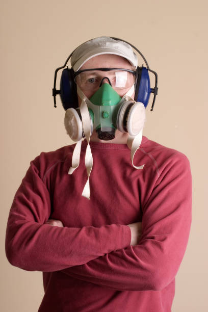 istock Young Man Wearing Goggles, Respirator, and Hearing Protection 108149204