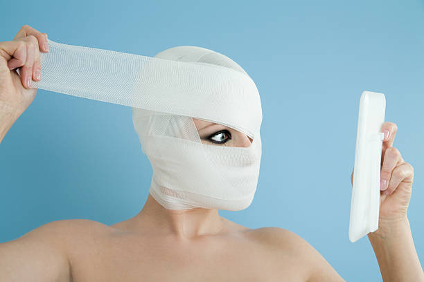 chirurgia plastica - plastic surgery bandage surgery women foto e immagini stock