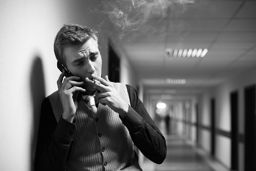 smoking  business man  speaking cellphone