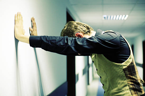 istock Stressed Young Businessman Standing in Office Hallway 108149570