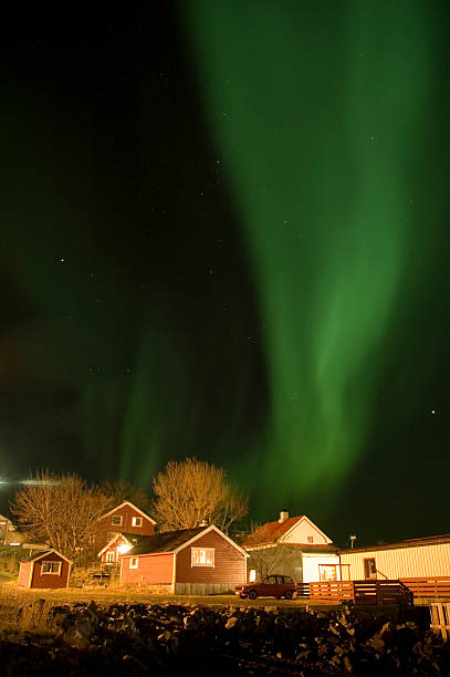 aurora borealis over boathouse stock photo