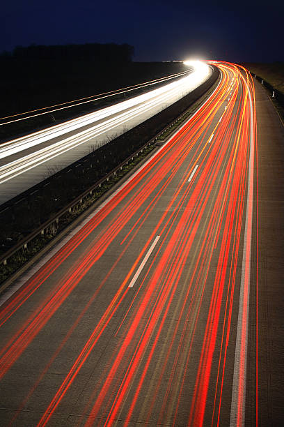 istock Blurred Motion of Car Lights on Highway at Night 108149690