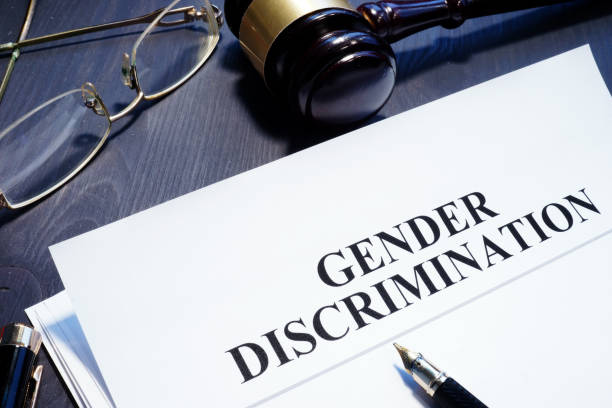 istock Document about Gender Discrimination and gavel on a desk. 1081498058
