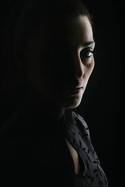 penumbra  woman alone dark shadow stock pictures, royalty-free photos & images