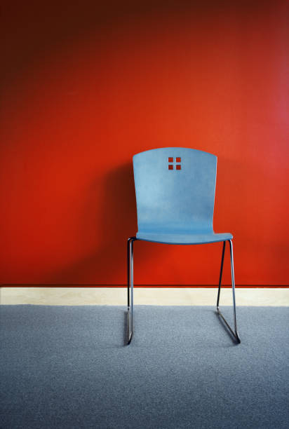 istock Blue Chair Against Red Wall 108149881