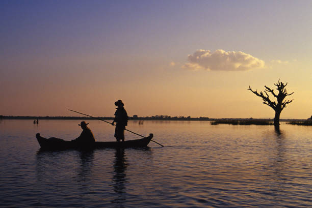 istock Two fisherman in a canoe 108149976