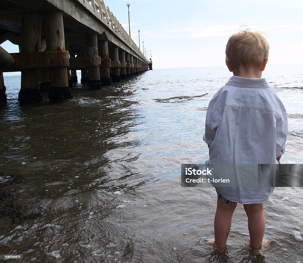 Boy & Sea  Ankle Deep In Water Stock Photo