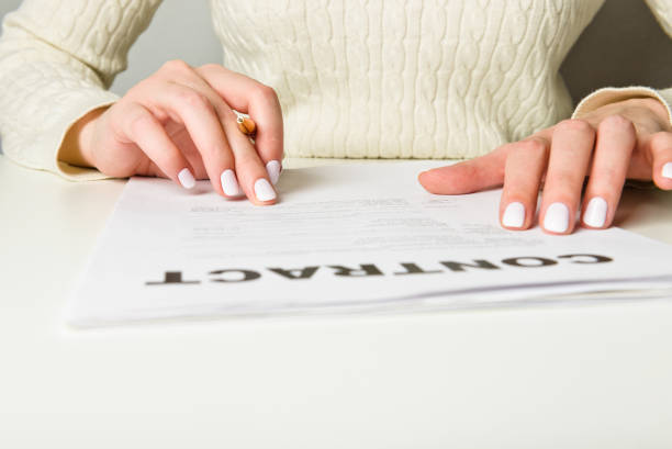 istock Woman hand signing a contract 1081500478