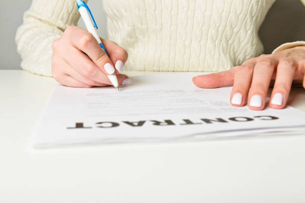 istock Woman hand signing a contract 1081500484