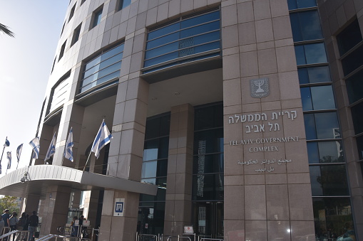 Tel Aviv, Israel, December 12, 2018:The government complex is a building through which various government bodies operate, Such as the Tax Authority, the Immigration Authority, the Population Authority, and others\n In the photo you can see the main entrance to the Government Compound building.\nLocation: 125 Menachem Begin Rd., Tel Aviv-Jaffa.