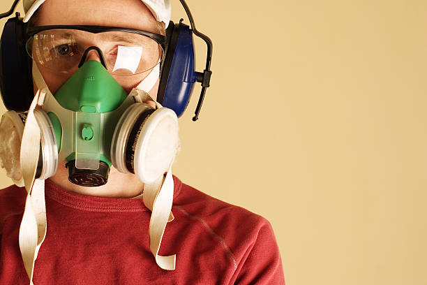istock Young man wearing goggles, respirator, and ear muffs 108150187