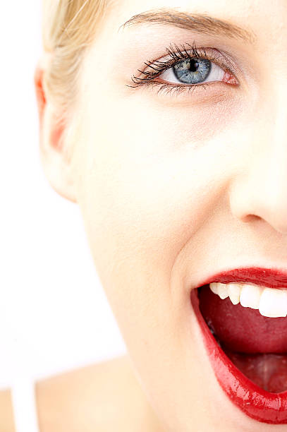istock Half of Young Woman's Face Smiling, High Key 108150338