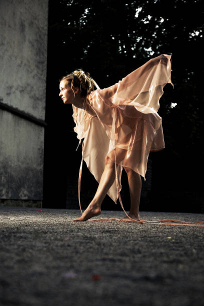 istock Woman Dressed as a Fairy and Posing in Courtyard 108150383