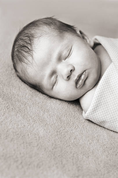 istock Newborn Baby Sleeping, Black and White 108150416