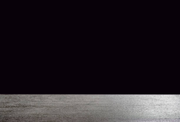 istock Dark background in front of grey empty stone concrete table floor, space for text 1081504162