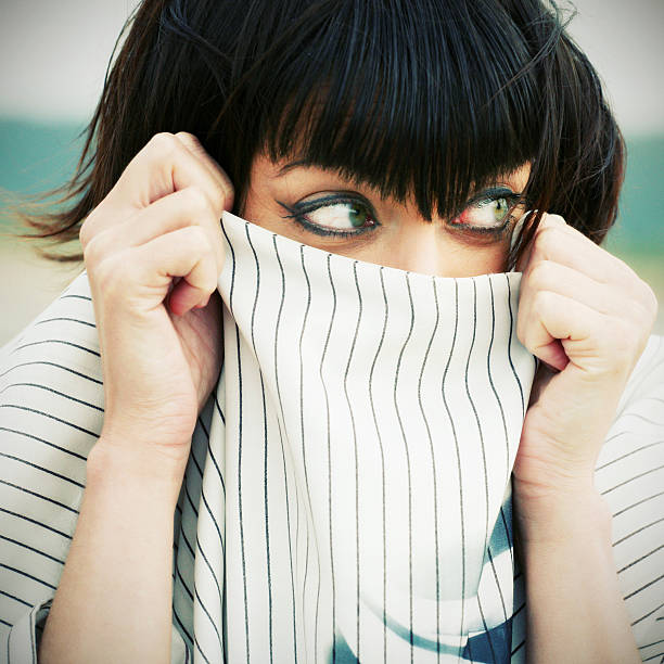 istock Young Woman Hiding in Shirt Collar 108150645