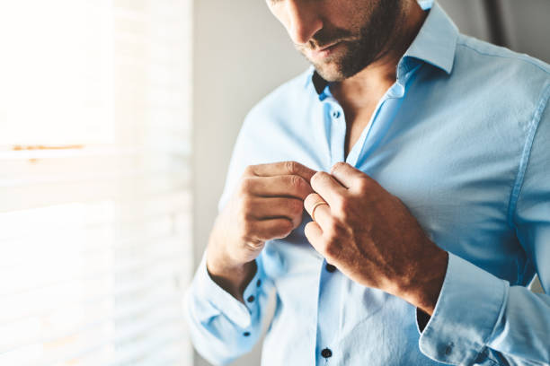 istock Have to button up my shirt 1081507476