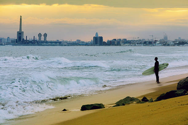 istock Young Man Holding Surfboard On Beach, Barcelona in Background 108150850