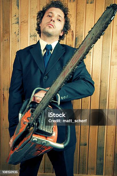 Businessman Holding Chainsaw Stock Photo - Download Image Now - Chainsaw, Suit, Only Men