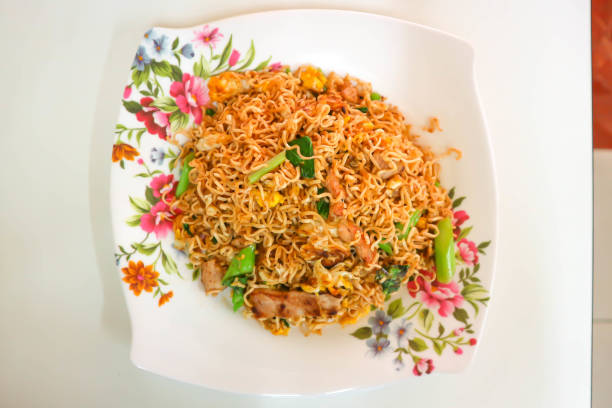 cooked instant noodles with a fork