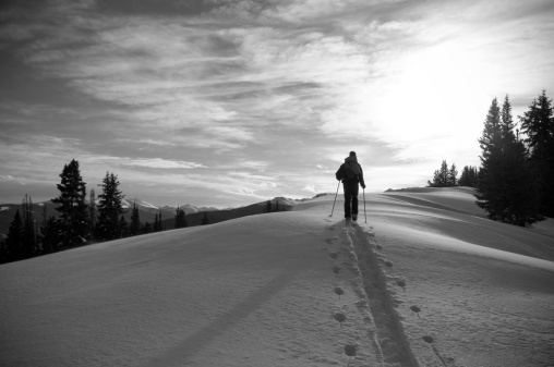 Silhouetted Solo Male Skier in Colorado Backcountry