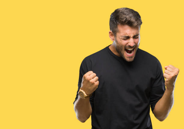 istock Young handsome man over isolated background very happy and excited doing winner gesture with arms raised, smiling and screaming for success. Celebration concept. 1081513868