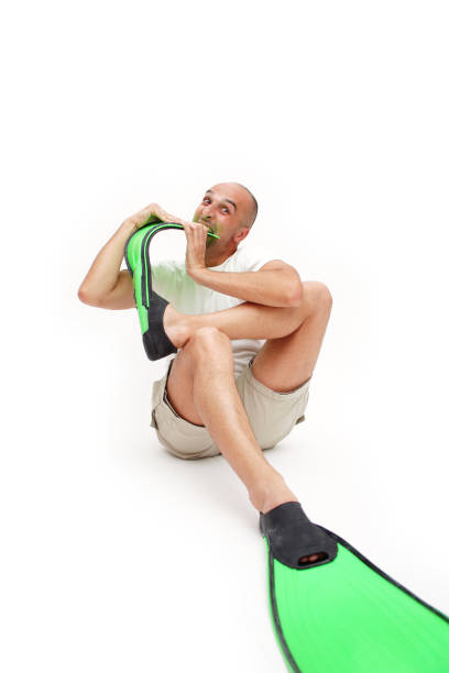 Asleep man in pajamas floating in the air isolated on white background