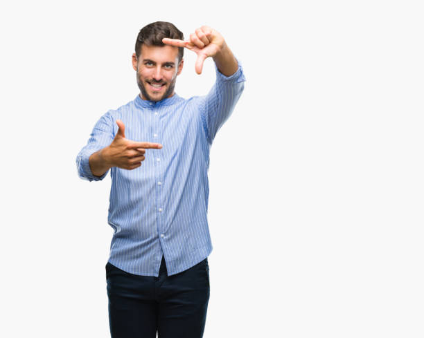 istock Young handsome man over isolated background smiling making frame with hands and fingers with happy face. Creativity and photography concept. 1081516028