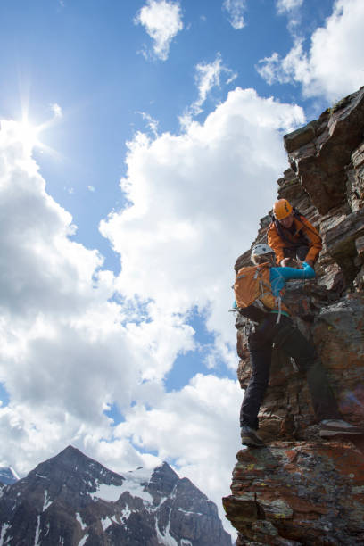 istock Climber gives a helping hand to other climber 1081516218