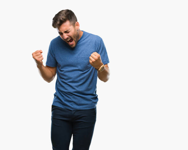 istock Young handsome man over isolated background very happy and excited doing winner gesture with arms raised, smiling and screaming for success. Celebration concept. 1081516416