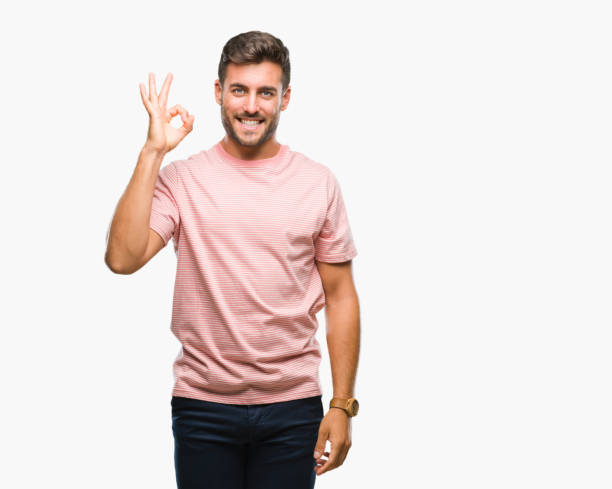 istock Young handsome man over isolated background smiling positive doing ok sign with hand and fingers. Successful expression. 1081517032