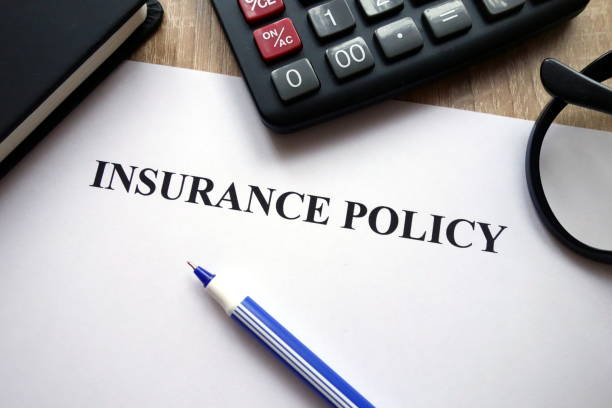 istock Insurance policy document, calculator, pen and glasses 1081518788