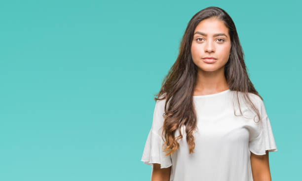 istock Young beautiful arab woman over isolated background with serious expression on face. Simple and natural looking at the camera. 1081518942