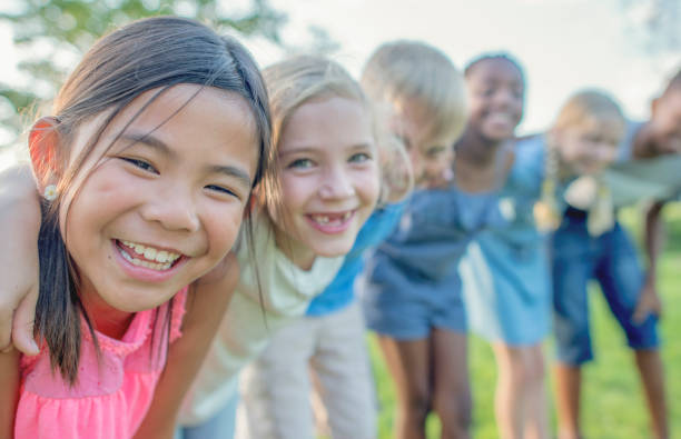 istock Young kids playing in a park 1081521592