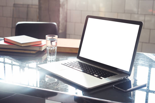 istock Closeup view of opened laptop screen, space for design layout. Co-working open space loft, mobile smartphone, metallic cold interior. 1081522108