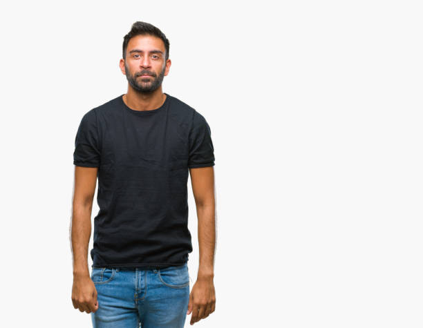 istock Adult hispanic man over isolated background with serious expression on face. Simple and natural looking at the camera. 1081522854