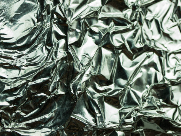 istock Silver foil with shiny crumpled texture background 1081524458
