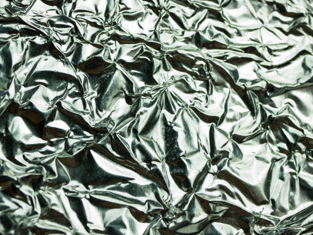 istock Silver foil with shiny crumpled texture background 1081524586