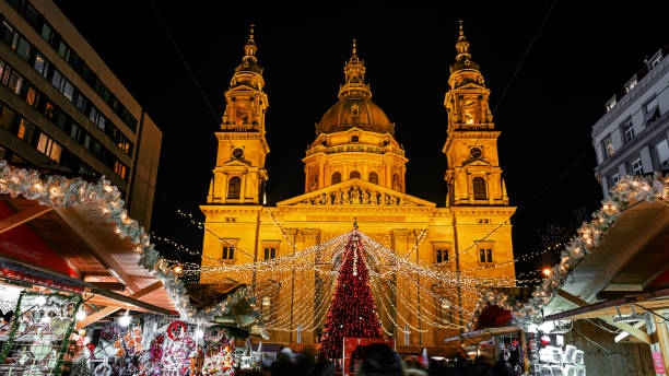 Christmas market  -Budapest - Hungary Christmas market on Vorosmarty square before Saint Stephen basilica in the evening lights - Budapest, Hungary budapest stock pictures, royalty-free photos & images