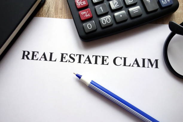 istock Real estate claim, calculator, pen and glasses 1081534072