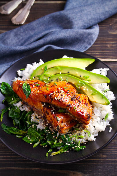 istock Salmon in honey-soy glaze with rice, spinach and avocado 1081537662