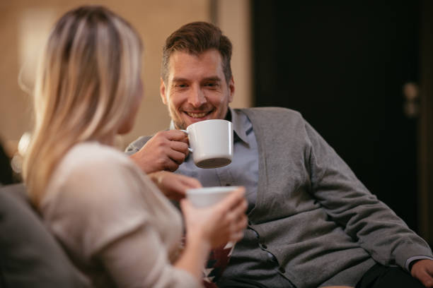 Man and woman cup of coffee tenderness love