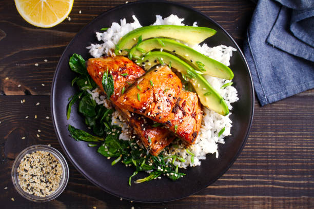 istock Salmon in honey-soy glaze with rice, spinach and avocado 1081539362