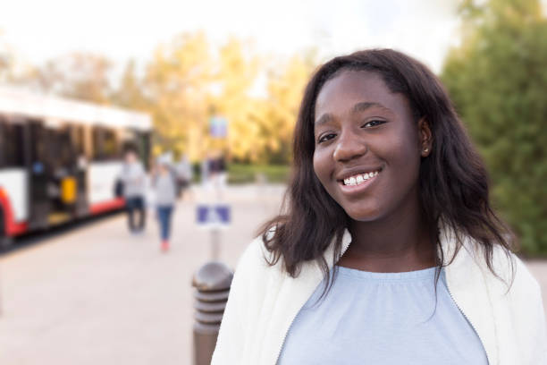 istock Happy black girl waiting the bus 1081546664