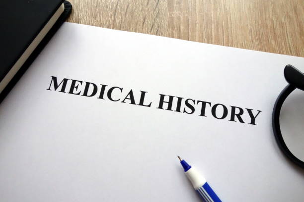 istock Medical history document, pen and glasses 1081546914