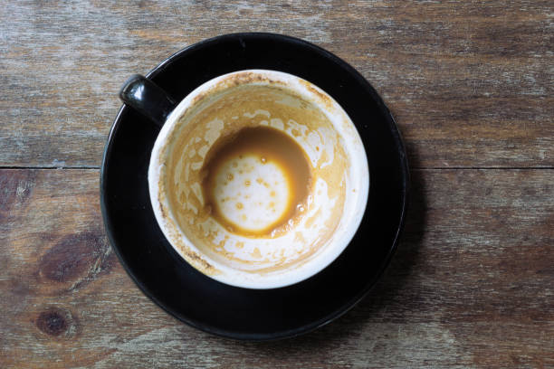 empty mug of coffee latte on vintage wooden table - lpn imagens e fotografias de stock